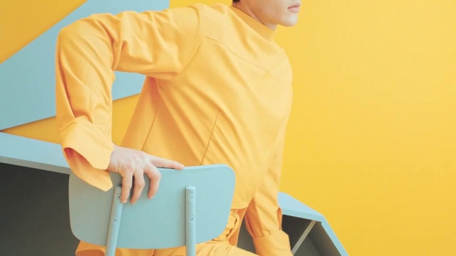 Video Reference N9: Yellow, Clothing, Orange, Sleeve, Shoulder, Outerwear, Workwear, Neck, Joint, Shirt