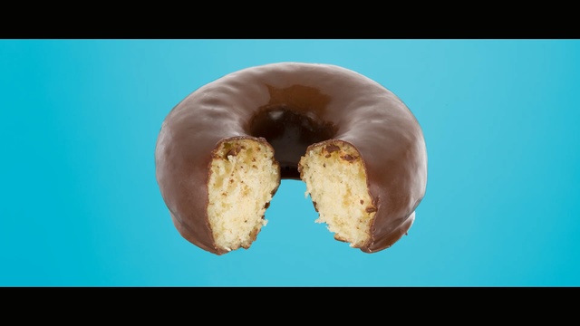 Video Reference N0: close up, jaw, doughnut, glaze, chocolate, sweetness