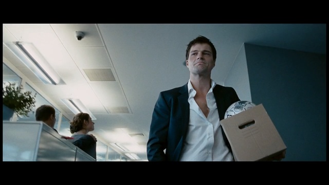 Video Reference N0: Suit, Photograph, Formal wear, White-collar worker, Tie, Snapshot, Male, Gentleman, Standing, Public speaking, Person, Indoor, Man, Front, Looking, Screen, Woman, Photo, Monitor, Table, Laptop, Holding, Television, Room, Computer, People, Large, Display, White, Group, Clothing, Human face, Text, Screenshot