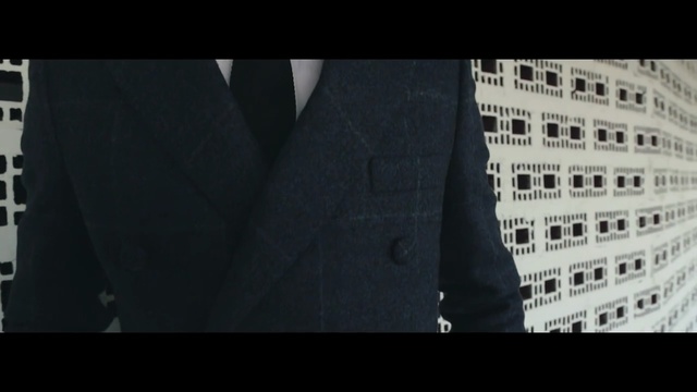 Video Reference N1: black, text, gentleman, black and white, outerwear, suit, font, screenshot, brand, angle, Person
