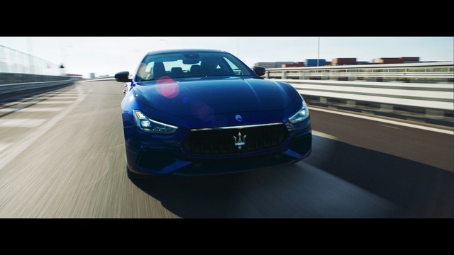 Video Reference N1: car, motor vehicle, vehicle, auto, automobile, speed, transportation, transport, fast, drive, sports car, wheel, luxury, motor, coupe, power, road, sport, race, driving, bumper, modern, sedan, sports, style, headlight, design, shiny, grille, tire, expensive, chrome, convertible, cars, metal, wheeled vehicle, new