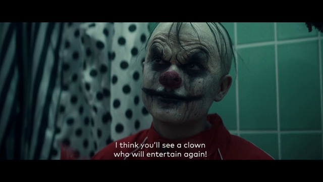 Video Reference N6: Joker, Fiction, Head, Clown, Fictional character, Photo caption, Human, Supervillain, Organism, Mouth