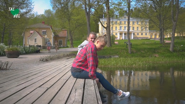 Video Reference N1: Waterway, Water, Leisure, Tree, Bank, Fun, Grass, Photography, Pond, Sitting, Outdoor, Person, Young, Standing, Man, Park, Holding, Girl, Bench, Boy, Sidewalk, Little, Woman, Street, Walking, Wearing, Riding, Suitcase, Red, Board, Clothing, House, Lake, Walkway