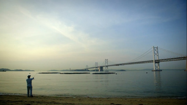 Video Reference N1: sky, sea, bridge, horizon, calm, cloud, fixed link, suspension bridge, river, morning, Person