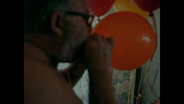 Video Reference N1: red, man, facial expression, nose, fun, balloon, emotion, mouth, smile, hand