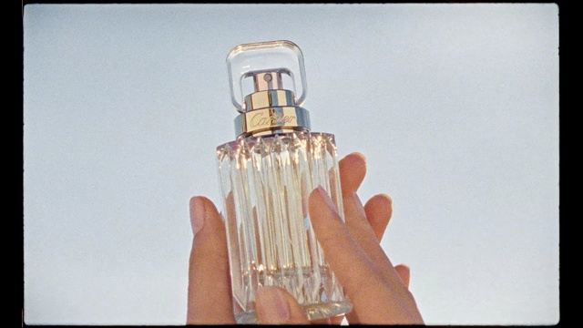 Video Reference N2: glass bottle, hand, perfume, finger, bottle, product, glass