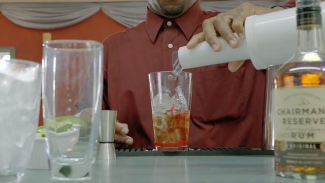Video Reference N6: drink, liqueur, distilled beverage, alcoholic beverage, cocktail, bottle, glass bottle, barware, alcohol, Person