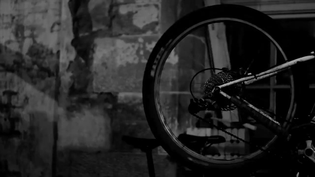 Video Reference N4: black, black and white, monochrome photography, spoke, darkness, mode of transport, wheel, photography, bicycle wheel, light, Person