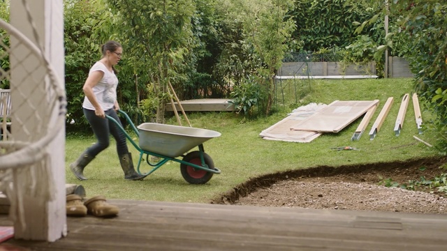 Video Reference N3: Wheelbarrow, Grass, Cart, Vehicle, Leisure, Yard, Backyard, Tree, Table, Lawn