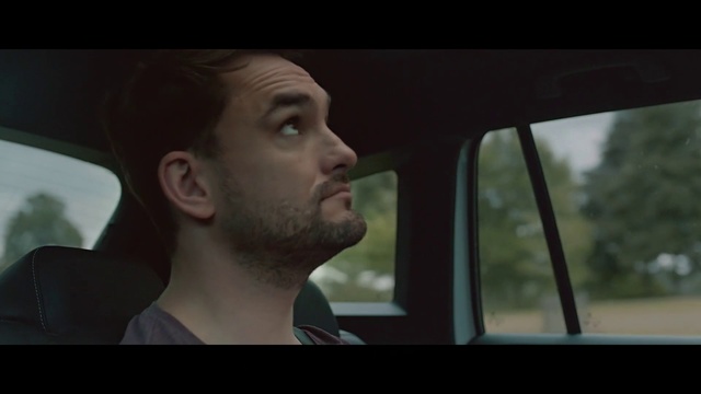 Video Reference N7: Face, Driving, Nose, Human, Movie, Family car, Facial hair, Photography, Automotive design, Mouth