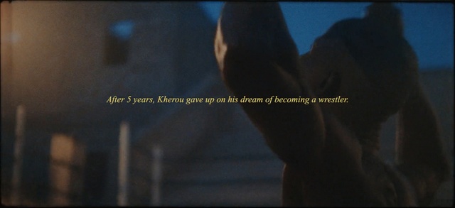 Video Reference N3: Text, Font, Human, Darkness, Screenshot, Adaptation, Organism, Movie, Batman, Hand