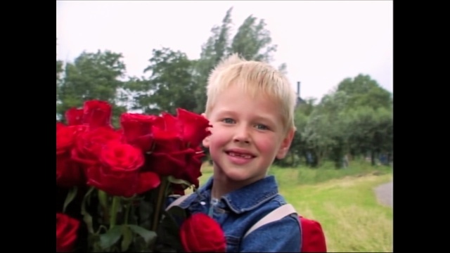 Video Reference N1: plant, flower, red, people, photograph, facial expression, flowering plant, smile, day, child, Person