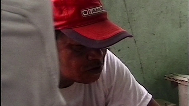 Video Reference N2: Red, Clothing, Cap, Hat, T-shirt, Nose, Baseball cap, Headgear, Facial hair, Sleeve