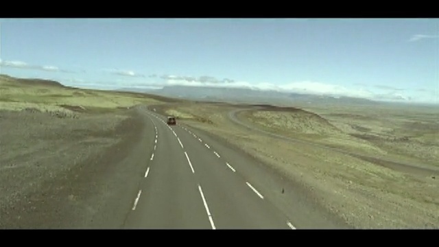 Video Reference N1: road, ecosystem, highway, steppe, mode of transport, ecoregion, infrastructure, road trip, sky, grassland