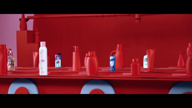Video Reference N12: Red, Person, Shelf, Sitting, Table, Orange, Small, Display, Large, Man, Counter, Truck, Holding, White, Woman, Standing, Room, Pink, Bottle, Soft drink, Drink, Cup