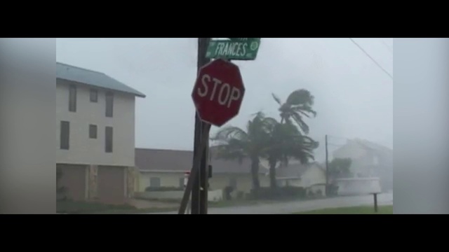 Video Reference N3: Atmospheric phenomenon, Stop sign, Traffic sign, Signage, Mode of transport, Street sign, Sign, Tree, Font, House