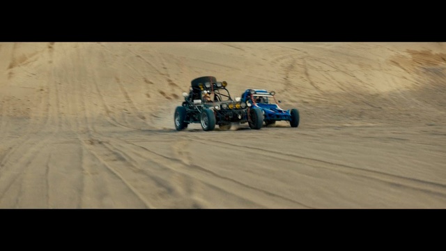 Video Reference N0: sand, mode of transport, desert, race track, landscape, dirt track racing, extreme sport, material, terrain, adventure
