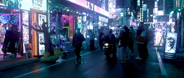 Video Reference N4: blue, snapshot, city, street, night, metropolis, tourist attraction, metropolitan area, shopping, darkness, Person