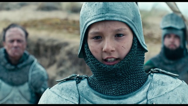 Video Reference N0: Human, Headgear, Helmet, Adaptation, Screenshot, Person, Outdoor, Clothing, Man, Holding, People, Little, Standing, Small, Wearing, Riding, Sitting, Green, Bench, Young, Boy, Park, Blue, Hat, Field, Group, Skiing, White, Human face, Toddler, Fashion accessory, Face, Scarf, Bonnet, Girl