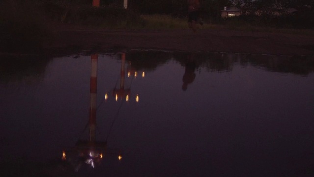 Video Reference N1: Sky, Water, Night, Reflection, Darkness, Atmospheric phenomenon, Light, Lighting, Atmosphere, Cloud, Person