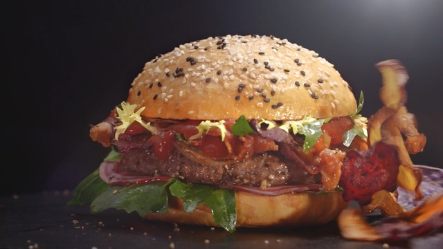 Video Reference N1: hamburger, veggie burger, fast food, sandwich, food, buffalo burger, dish, cheeseburger, junk food, salmon burger