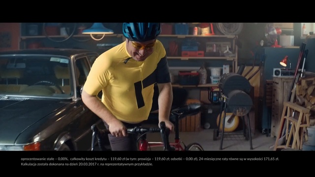 Video Reference N1: Mode of transport, Helmet, Vehicle, Bicycle, Snapshot, Personal protective equipment, Fictional character, Eyewear, Arm, Headgear, Person, Young, Woman, Car, Black, Table, Man, Holding, Wearing, Board, Standing, Computer, Riding, White, Street, Text, Screenshot, Clothing