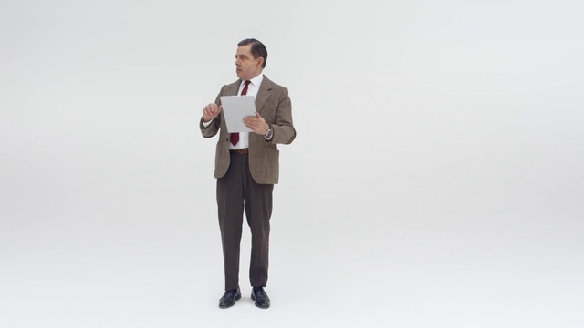 Video Reference N0: Standing, Suit, Product, Human, Businessperson, Formal wear, White-collar worker, Photography, Gesture, Beige