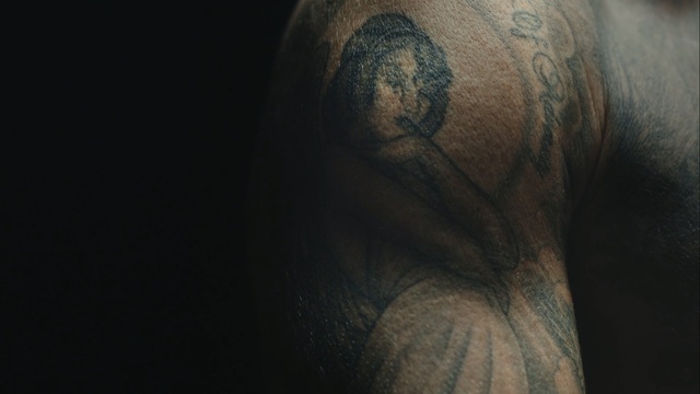 Video Reference N13: close up, darkness, eye, arm, human, hand, chest, tattoo, facial hair, flesh