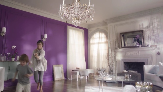 Video Reference N3: purple, room, interior design, ceiling, living room, home, furniture, function hall, decor, dining room, Person