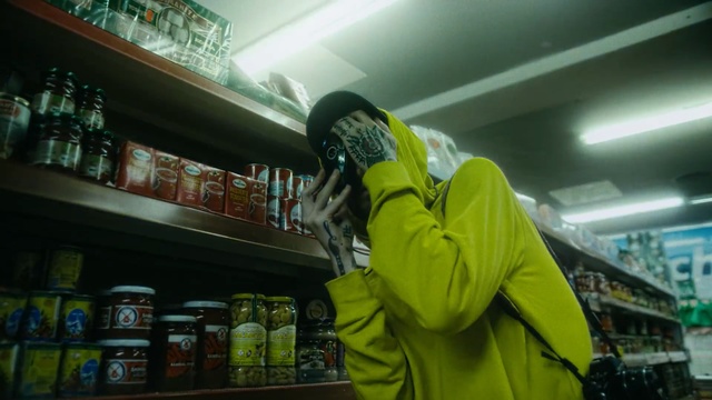 Video Reference N0: Green, Supermarket, Convenience store, Snapshot, Yellow, Outerwear, Jacket, Grocery store, Personal protective equipment, Retail