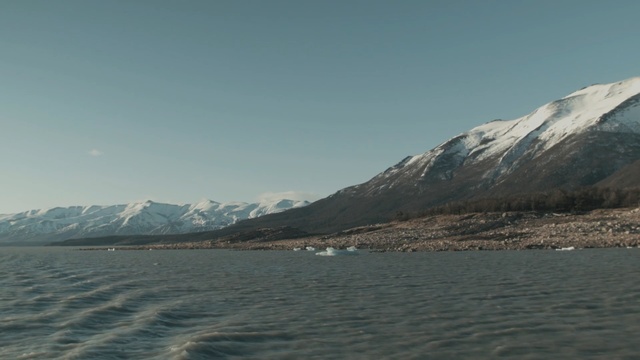 Video Reference N2: Body of water, Sky, Mountainous landforms, Highland, Mountain, Mountain range, Sea, Sound, Fjord, Fell