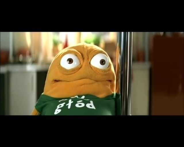 Video Reference N3: Facial expression, Green, Smile, Cartoon, Head, Yellow, Organism, Mouth, Toy, Animation
