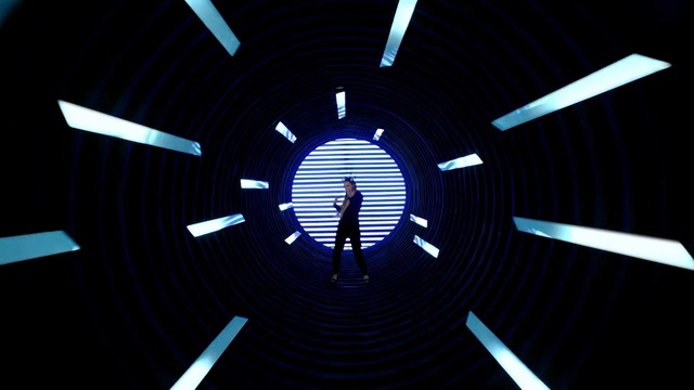 Video Reference N0: Light, Design, Technology, Circle, Symmetry, Electric blue, Pattern, Space, Graphic design, Graphics, Person