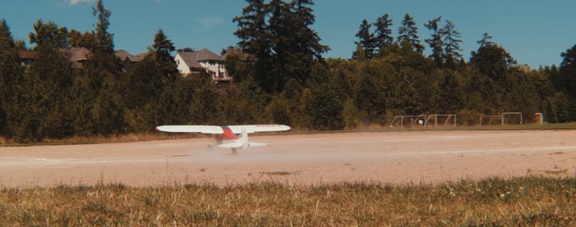 Video Reference N3: sky, field, tree, airplane, aviation, aircraft, vehicle, grass, water, plant