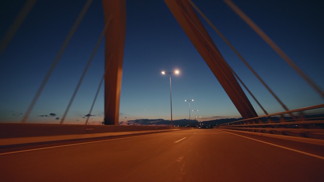 Video Reference N1: sky, infrastructure, road, horizon, fixed link, atmosphere, bridge, light, night, dusk