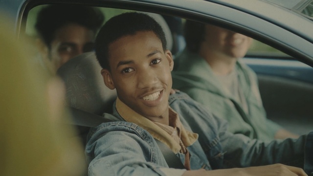 Video Reference N3: Face, Forehead, Driving, Vehicle door, Smile, Photography, Auto part, Car, Vehicle, Person