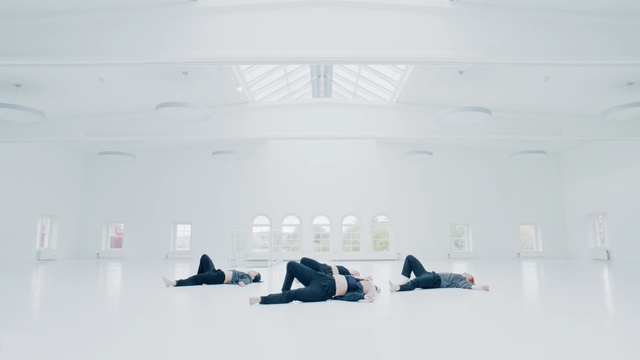 Video Reference N3: White, Line, Room, Sitting, Architecture, Floor, Shoe, Window, Winter, Art, Person