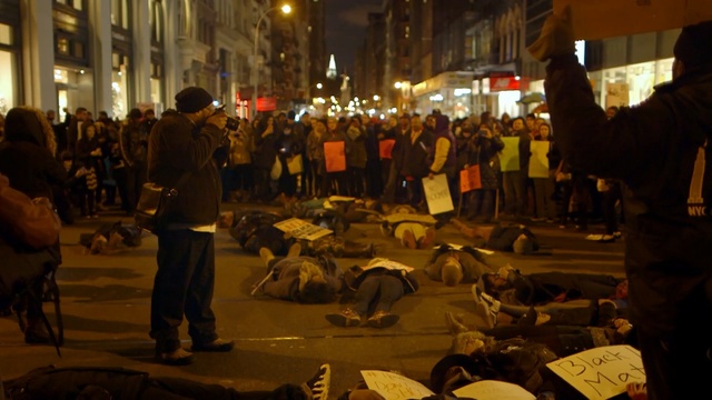 Video Reference N9: night, crowd, event, demonstration, riot, protest, street, city, Person