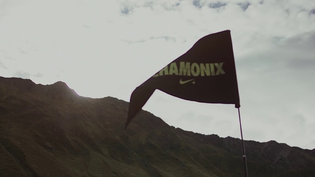 Video Reference N2: Flag, Sky, Mountain, Hill, Signage, Sign, Landscape, Mountain range, Wind