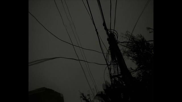 Video Reference N0: Sky, Electricity, Overhead power line, Grey, Twig, Tree, Transmission tower, Electrical wiring, Cable, Wire