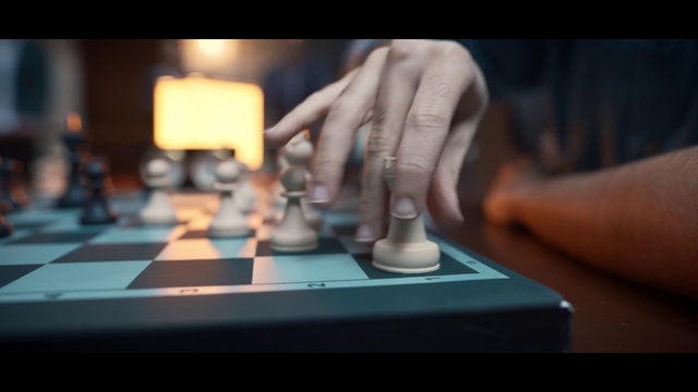 Video Reference N3: Gesture, Finger, Audio equipment, Gadget, Nail, Thumb, Wrist, Technology, Electronic instrument, Chessboard