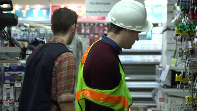 Video Reference N16: Hard hat, Helmet, Workwear, High-visibility clothing, Product, Standing, Headgear, Personal protective equipment, Engineering, Tartan