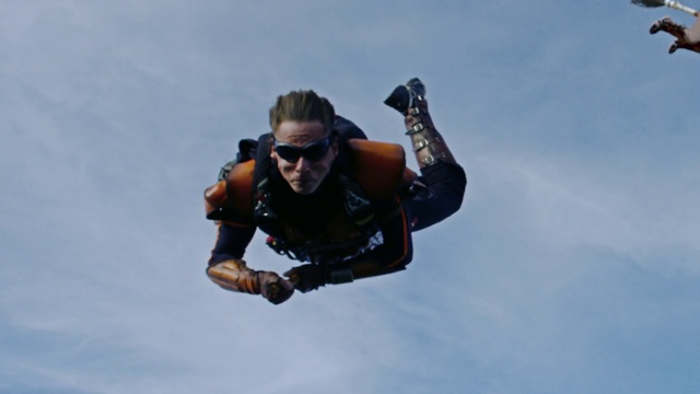 Video Reference N1: Tandem skydiving, Goggles, Sky, Cloud, Sunglasses, Sports equipment, Glove, Gesture, Parachuting, Helmet