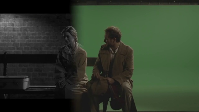 Video Reference N2: Coat, Event, Font, Darkness, Conversation, Sitting, Suit, Display device, Job, White-collar worker