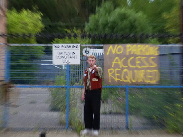 Video Reference N2: Plant, Fence, Tree, Asphalt, Grass, Leisure, Recreation, Road, Signage, Sport venue