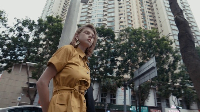 Video Reference N3: Building, Daytime, Street fashion, Tree, Waist, Tower block, Public space, Travel, City, Urban area