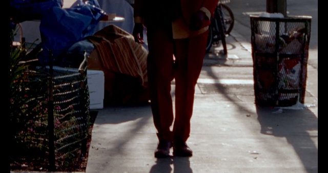 Video Reference N3: Leg, Shorts, Textile, Standing, Road surface, Street fashion, Waist, Thigh, Luggage and bags, Knee