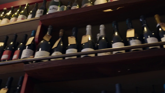 Video Reference N12: Bottle, Glass bottle, Wine cellar, Winery, Alcoholic beverage, Drink, Wine bottle, Shelf, Drinkware, Shelving