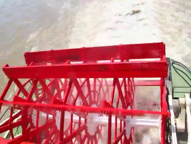 Video Reference N1: paddlewheel, Wheel, Building, Automotive tire, Water, Red, Automotive wheel system, Gas, Wood, Crane