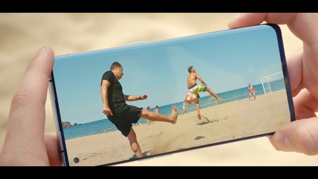 Video Reference N10: Photograph, People on beach, Shorts, Sky, Trunks, Gesture, Beach, Travel, People in nature, Gadget